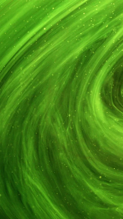 Vertical glitter mist ink swirl neon green paint Stock Footage 294093633
