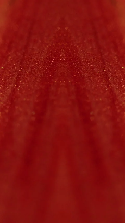 Vertical Glitter paint flow sparkling fluid red ink spill Video stock 274689845