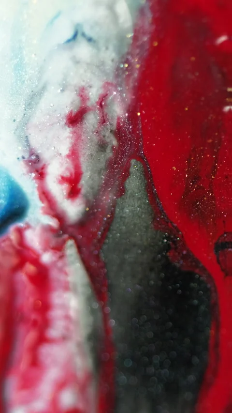 Vertical Glitter paint spill ink kaleidoscope red blue drip Video stock 276906773