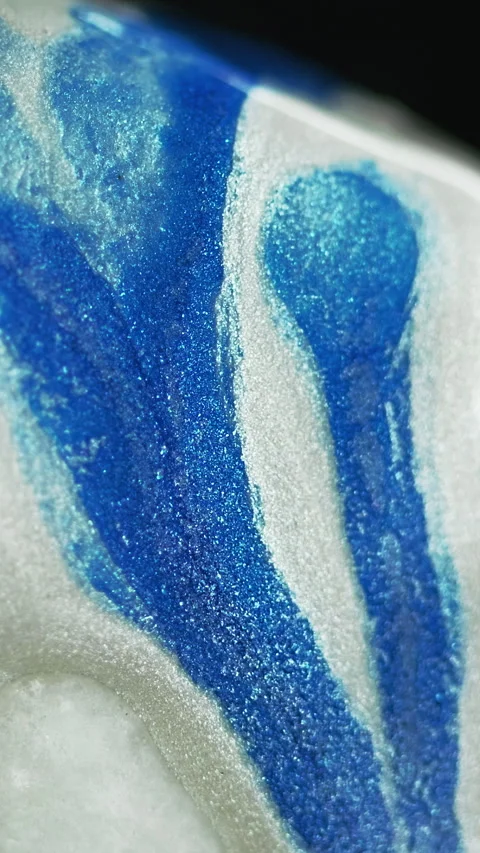 Vertical glitter paint spill ink drip blue white Video stock 285694619