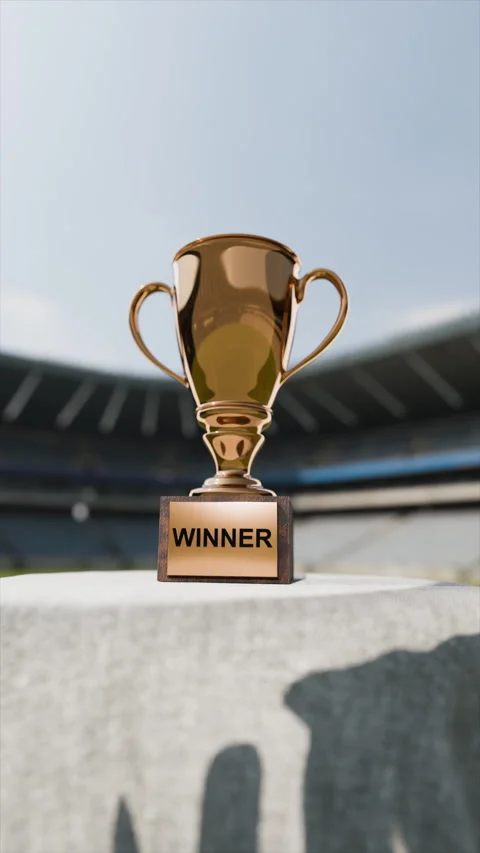 Vertical golden cup with winner text, soccer sports stadium with football field Stock Footage 301285526