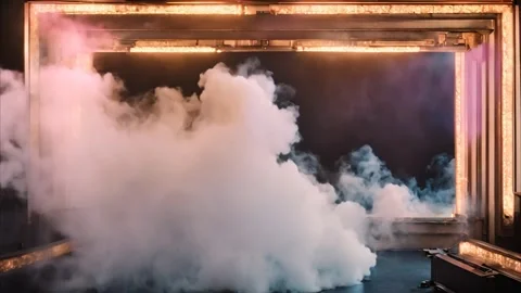 A vertical golden glowing frame, a gate and slowly moving dry ice smoke. Stock Footage 273954179