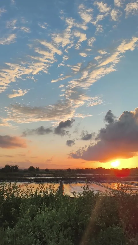 Vertical Golden Hour Sunset Over Salt Pans and Cloud Sky Stock-Footage 340420244