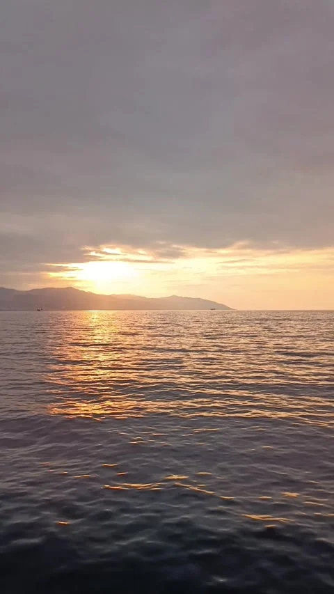 Vertical Golden Sunset Reflection on Calm Sea Surface Stock Footage 344013136