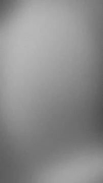 Vertical grayscale grainy textured background with smooth blur gradient per.. Stock Photos