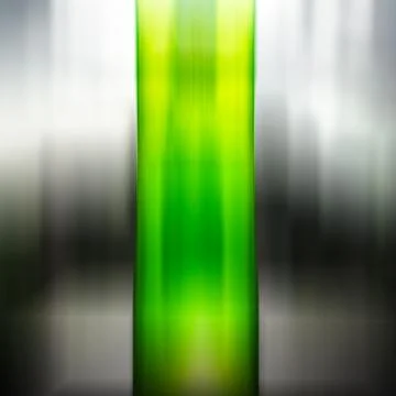 Vertical green motion blurred column on black and white backgrou Stock Photos