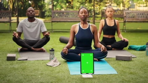 Vertical green screen mockup on tablet near participants doing deep breathing Stock Footage 346025928
