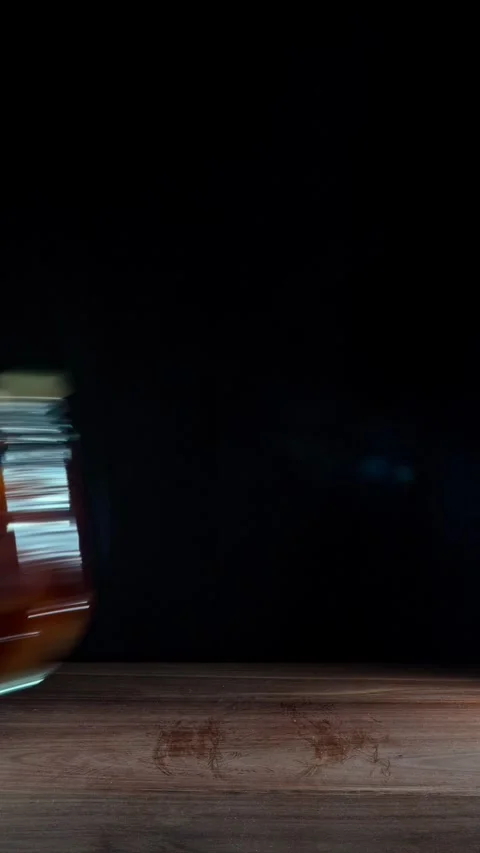 Vertical Hand Removing Ginger And Garlic Honey Jars Clearing Table Stock Footage 324922341