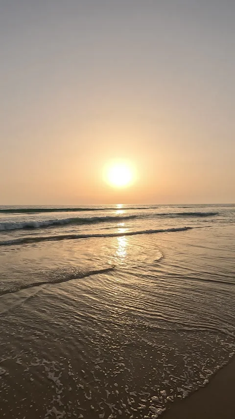 Vertical hand-shot video of beautiful sunset over ocean Stock Footage 332065241