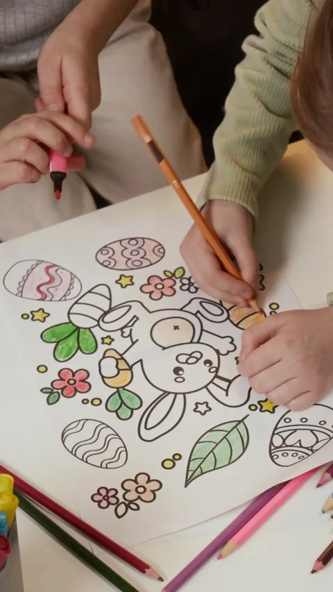 Vertical of Hands of Creative Children Coloring Easter Rabbit Drawing Stock Footage 327888328