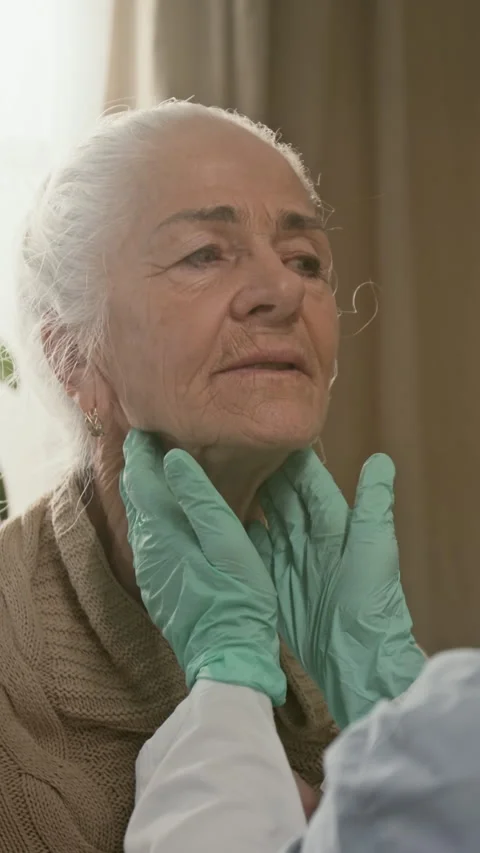 Vertical of Hands of Female Doctor Checking Elderly Patients Lymph Nodes Stock Footage 329177634