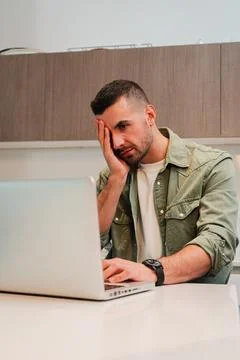 Vertical. Hard working man, desperate due to laptop issues causing her stress Stock Photos