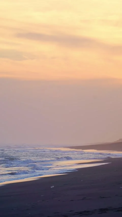 Vertical Hazy Sunset Beach Waves Stock Footage 337533571