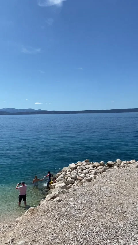 Vertical HD - Pan View Pebble Beach Sea Monument Podgora Makarska Riviera Stock Footage 345278078