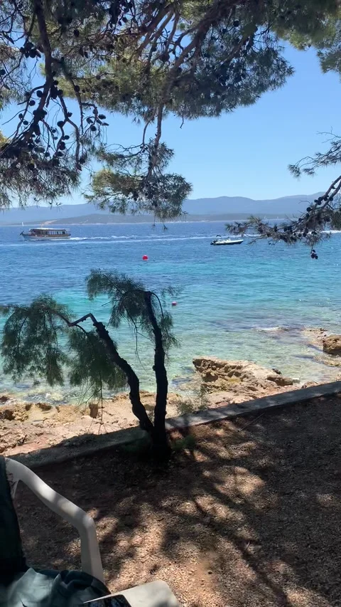 Vertical HD - Relaxing Beach Table Book Turquoise Sea View Bol Brac Island Video stock 345278061