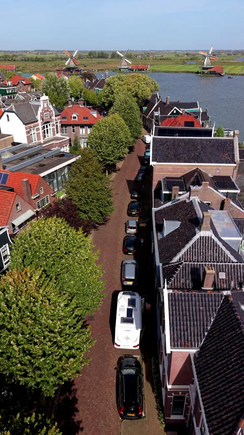 Vertical high-angle aerial drone view of street with parked cars and camper Stock-Footage 347332897