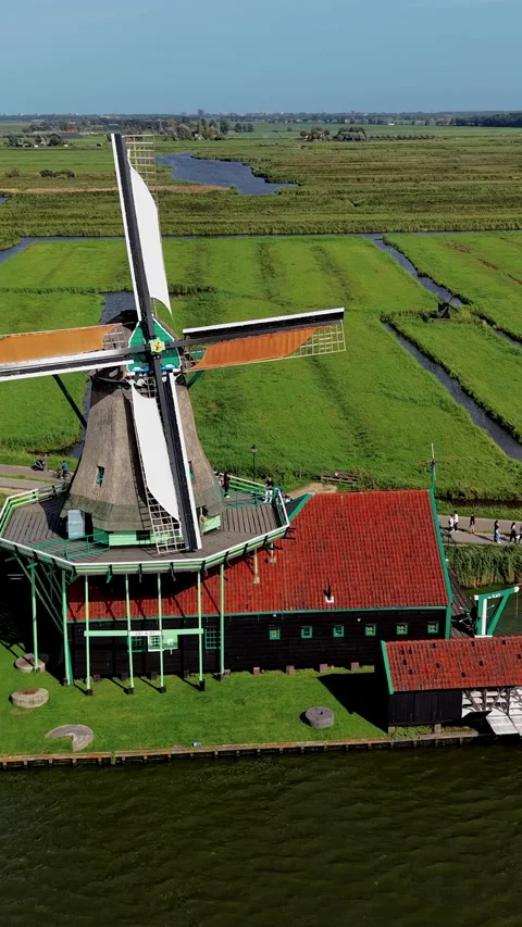 Vertical high-angle aerial drone view of De Kat historic paint windmill Stock-Footage 347334659