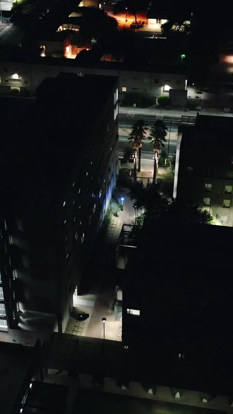 VERTICAL HIGH ANGLE NIGHT CITY COLLEGE CAMPUS Stock Footage 248576609