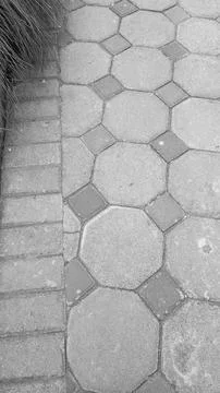 A vertical high angle perspective captures an intricate geometric walkway p.. Stock Photos