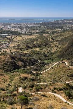 Vertical high-angle view from Arrbida Natural Park, Portugal. A winding road Foto stock