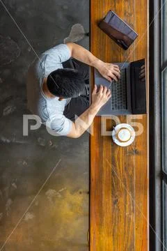 Vertical high angle view photo of businessman typing laptop Stock Photos