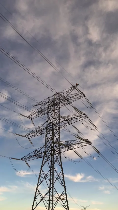 Vertical High Voltage Power Transmission Tower with Electric Cables Stock Footage 329894896
