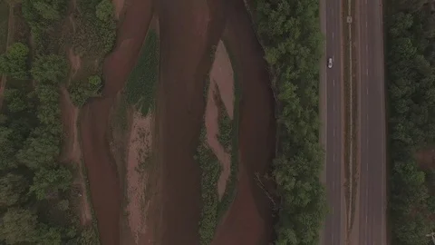 Vertical Hover Over River and Road Stock Footage 98847455