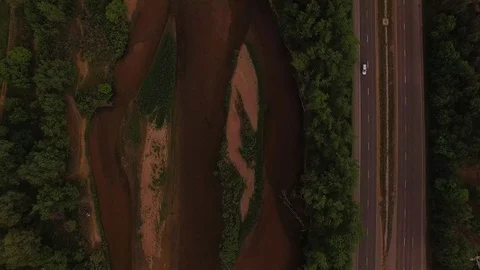 Vertical Hover Over River and Road Color Corrected Stock Footage 98847457