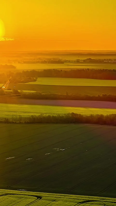Vertical Hyperlapse of Golden Sunset Over Patchwork Farmland Fields Stock Footage 345433627