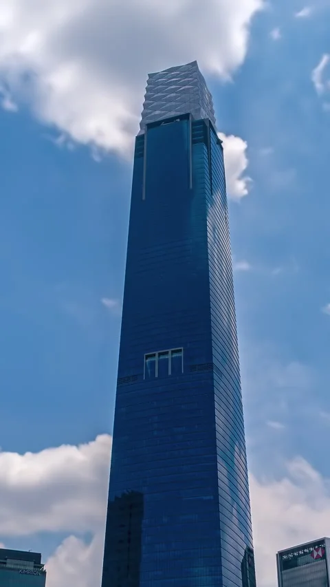 Vertical hyperlapse of a Kuala Lumpur skyscraper with moving clouds Stock Footage 344364407