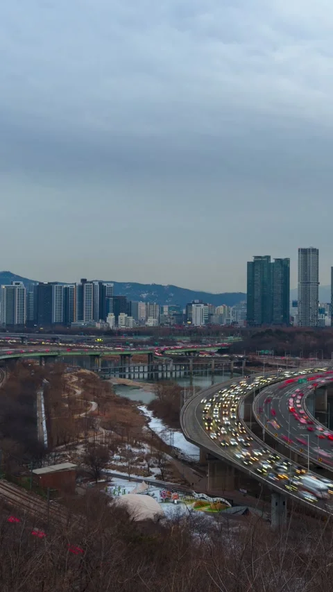 Vertical Hyperlapse Winter Day to Night Rush Hour Traffic on Gangbyeonbuk-ro Stock Footage 331062643