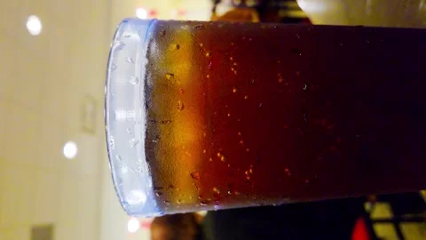 Vertical Ice Tea Drink sweating with bubbles in busy fastfood restaraunt buffet Stock Footage 336796630