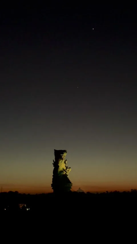Vertical Illuminated GWK Statue at Twilight Night in Bali Stock Footage 337354734