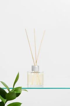 Vertical image aroma reed diffuser transparent glass jar with smell of fres.. Stock Photos