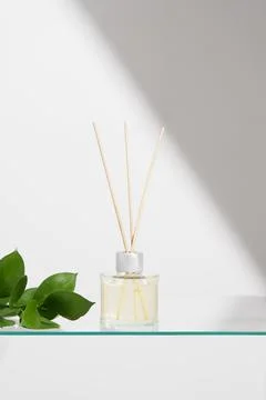 Vertical image aroma reed diffuser transparent glass jar with smell of fres.. Stock Photos