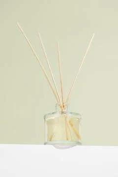 Vertical image aroma reed diffuser transparent glass jar with smell of fres.. Stock Photos