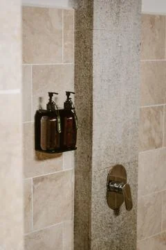 Vertical image of a bathroom interior design with natural elements and colo.. Stock Photos