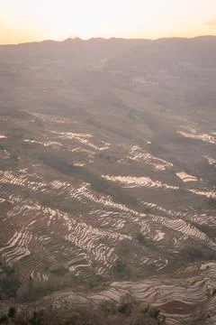 Vertical image of beautiful setting sun light above Bada Rice terraces, Yun.. Stock Photos