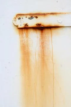 Vertical image of brown rust stain on plain white background Stock Photos