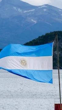 Vertical image close-up of the Argentian flag flying in the wind with mount.. Stock Photos