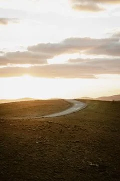 Vertical image of an empty mountain road between the hills of the outback o.. Stock Photos