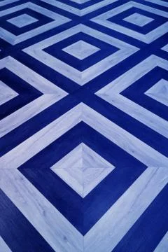 Vertical image of geometric pattern wooden floor in royal blue and light blue Stock Photos