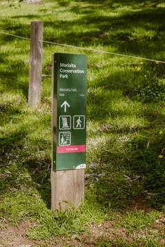Vertical image of a green direction sign of the Morialta Falls walk outdoor.. Stock Photos