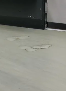 Vertical image of grubby dirty grey floor with raised staining Stock Photos