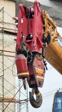 Vertical image of a hook attached to the end of a lifting crane Stock Photos