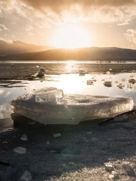 Vertical image Ice stacks in foreground at Vineyard Beach on Utah Lake in U.. Stock Photos