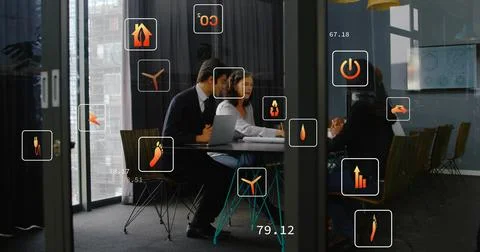 Vertical image: Man tapping laptop team pointing papers business icons showing Stock Photos