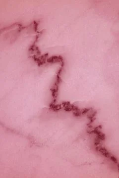 Vertical image of marble stone surface in pink color for texture background Stock Photos