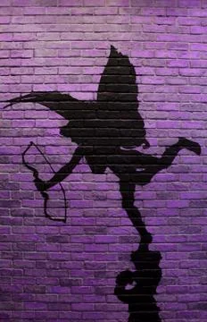 Vertical image of purple brick wall with the painting of cupid's silhouette Stock Photos