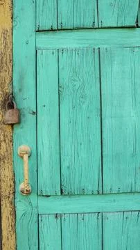 Vertical image of a rustic door with a padlock Stock Photos